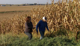 Stonyfield Farm VP Nancy Hirshberg talks with corn farmer Robert Hawthorn. / Source: Stonyfield Farm.