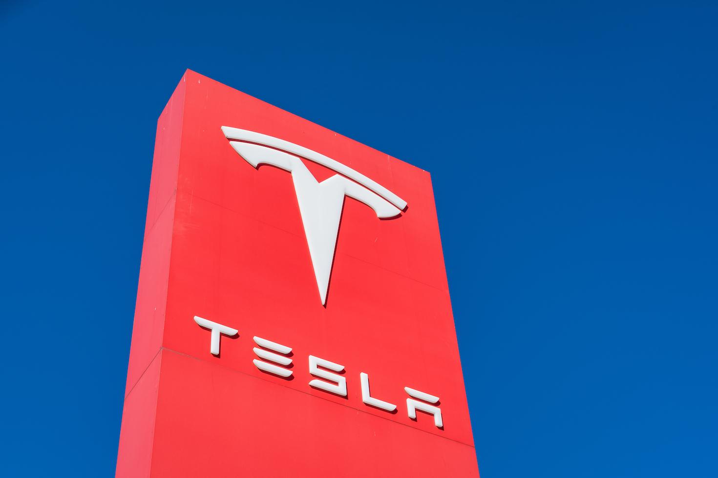 Tesla Motors red sign and logo