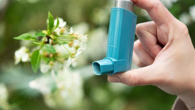 Inhaler next to a flower