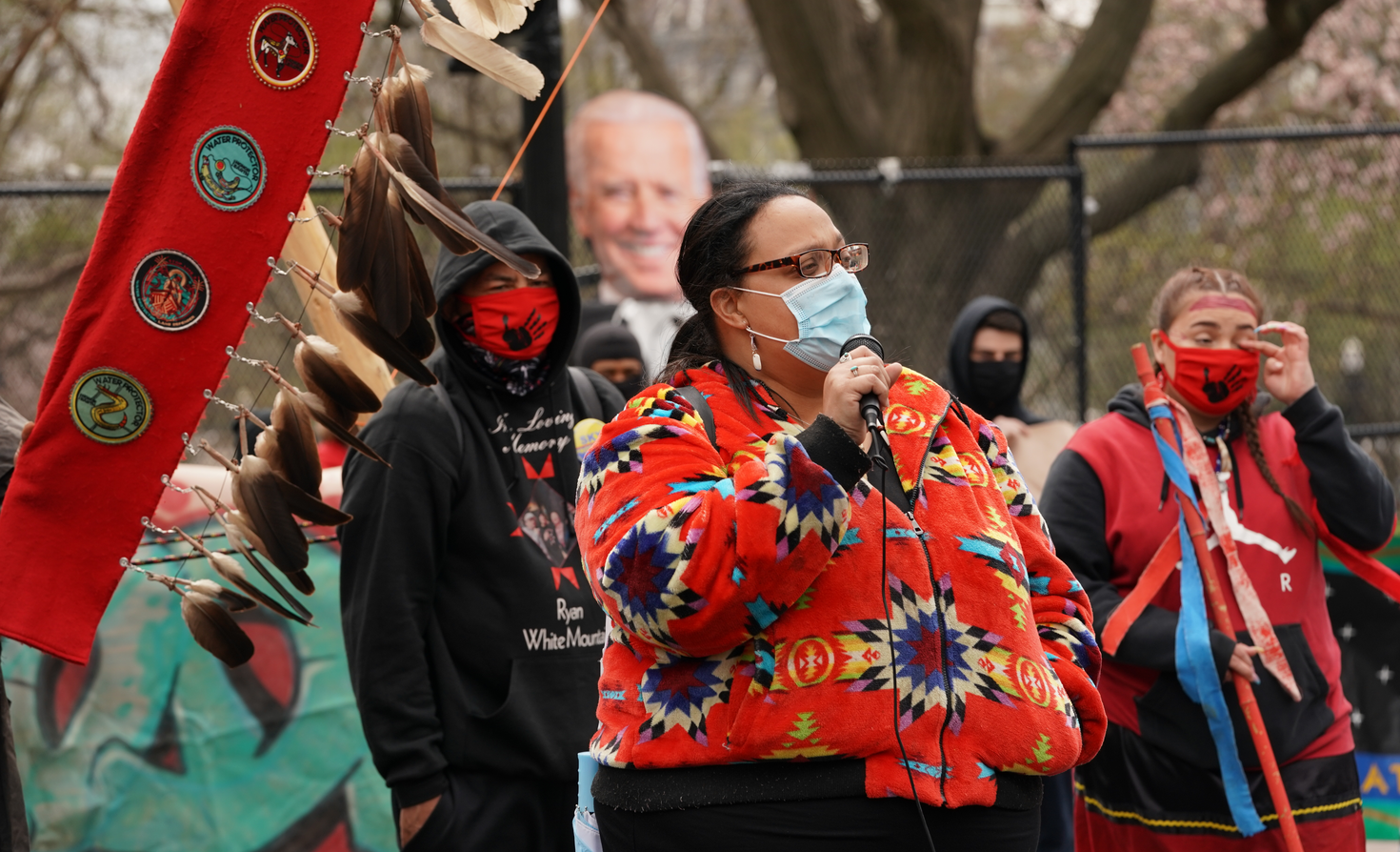 An indigenous woman speaks at the White House about the need to shut down the DAPL and Line 3 oil pipelines to preserve access to clean water.