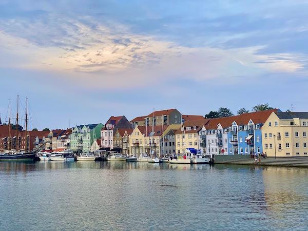 Colorful homes on the water in Copenhagen at sunset