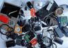 Pile of used electronic waste on white background