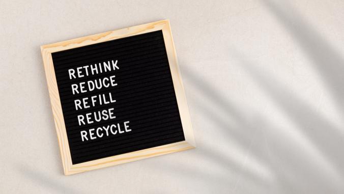 Black letter box with the words: Rethink, reduce, refill, reuse, and recycle in white letters