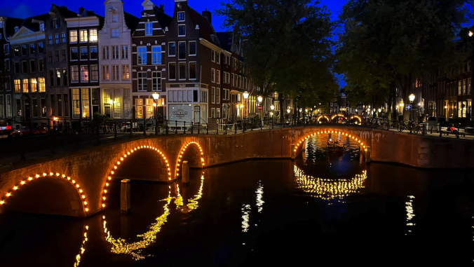 An Amsterdam canal at night.