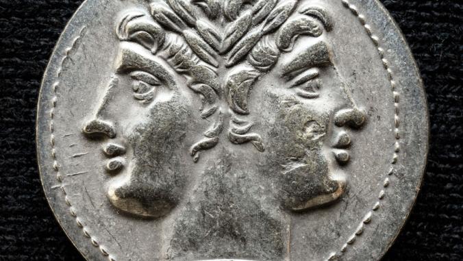 An ancient Roman coin depicting the two-faced god Janus.